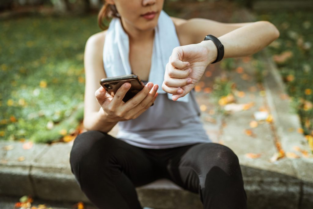 A woman checking her time after running