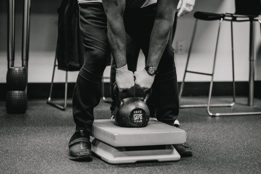 two hands on a kettlebell at Chain Effect