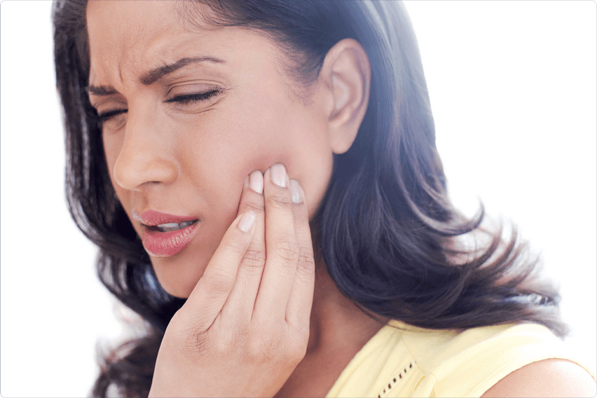 Woman suffering from TMJ