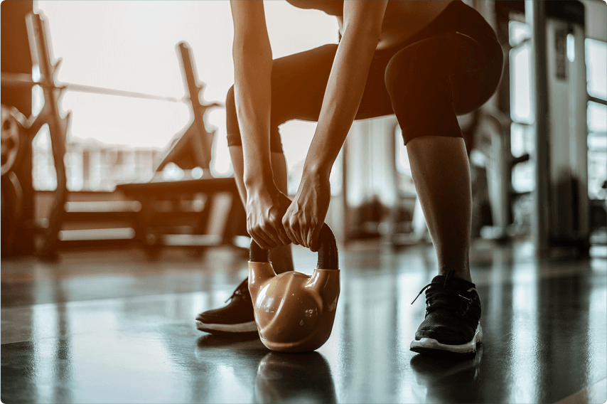 Woman exercising with a kettlebell